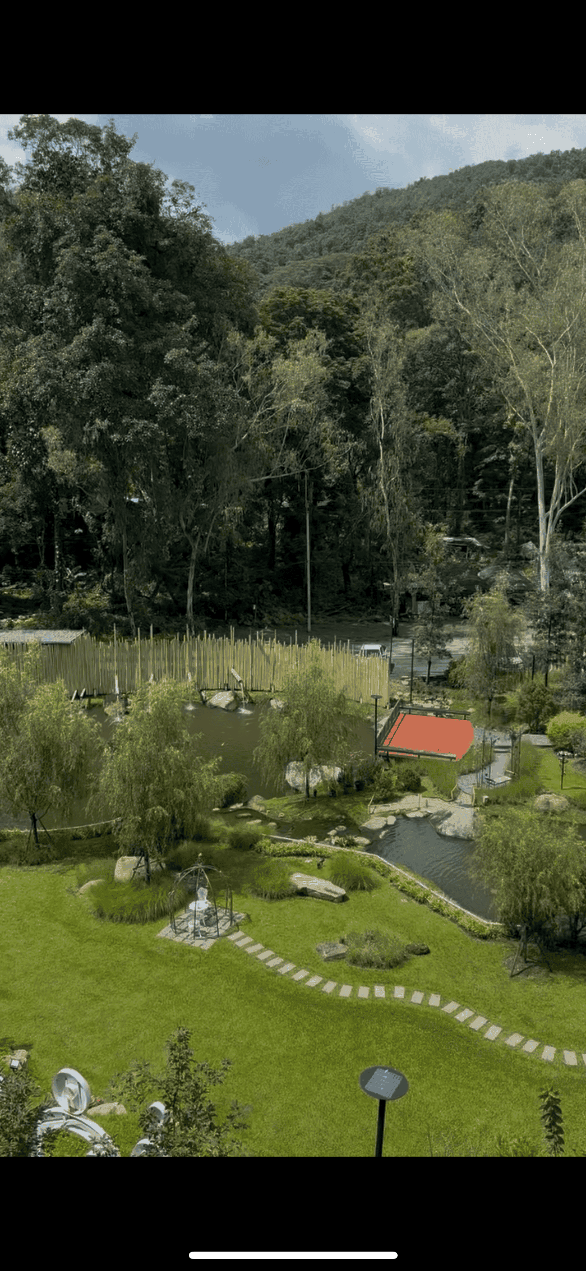 T-Story Mae Kampong property grounds with mountain views