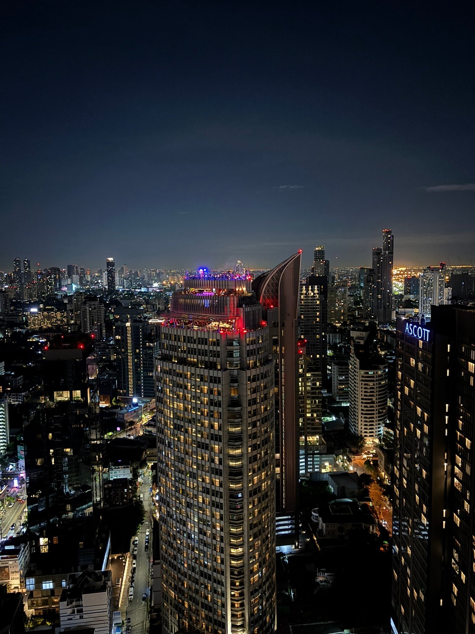 Tichuca rooftop bar sunset view over Bangkok