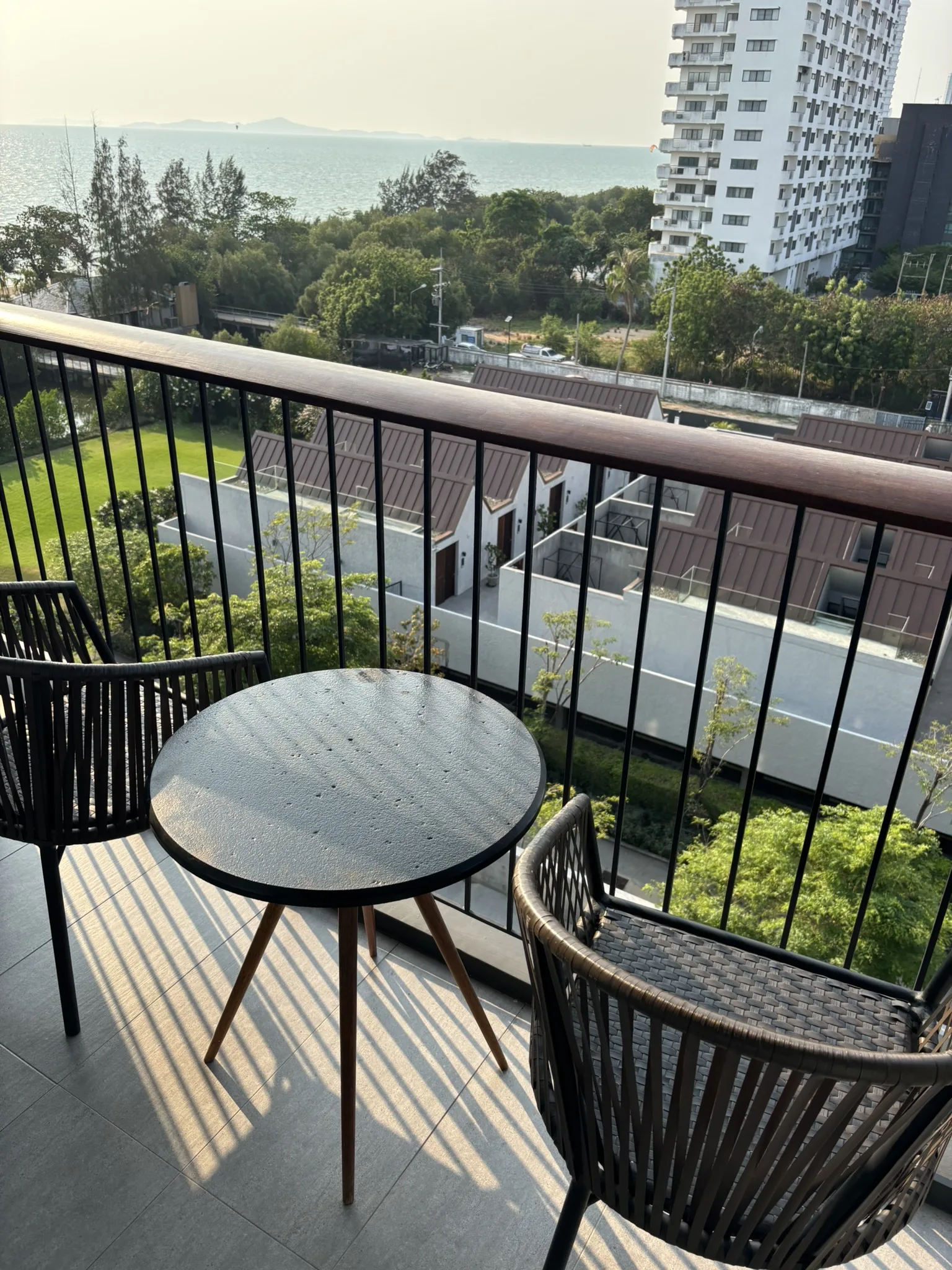 Balcony table and chairs overlooking the sea at Ana Anan Pattaya