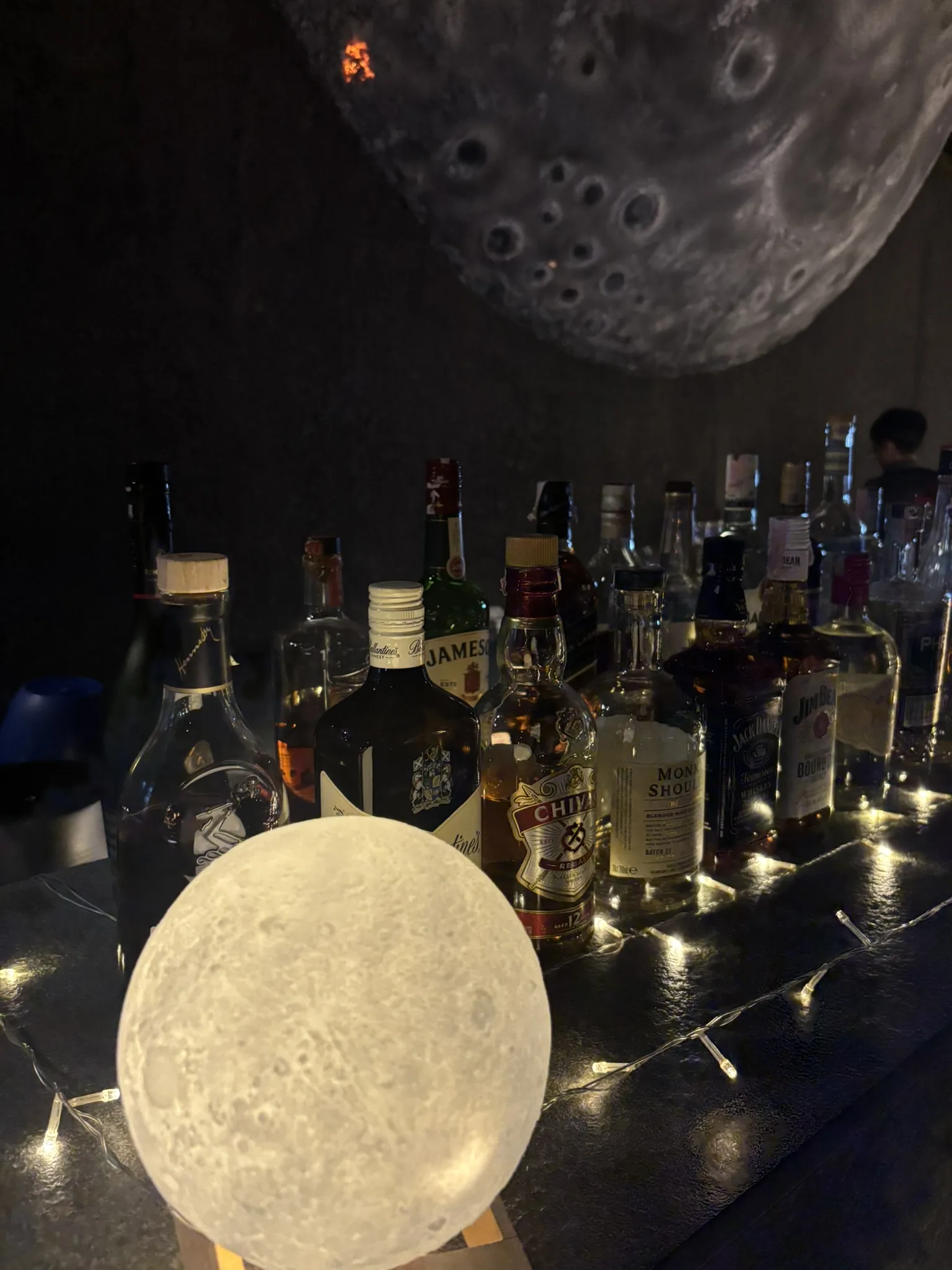 Over The Moon bar counter with spirits at Ana Anan Pattaya