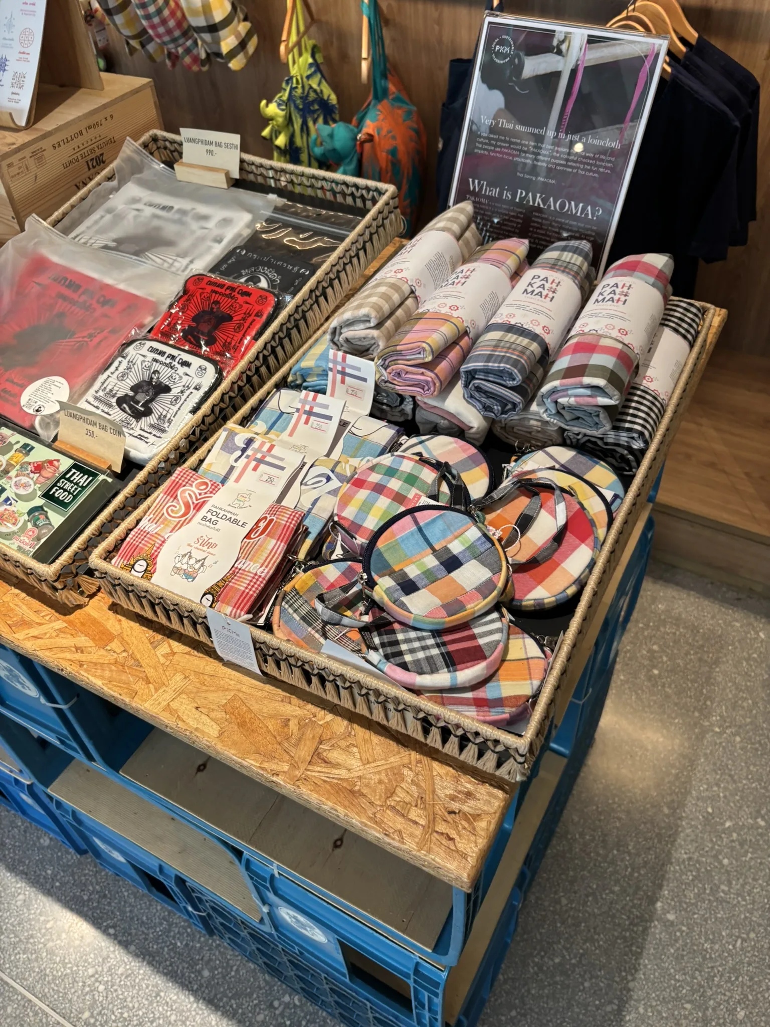 Hotel shop display featuring Pakaoma traditional Thai textiles and patterned accessories at ASAI Bangkok Chinatown