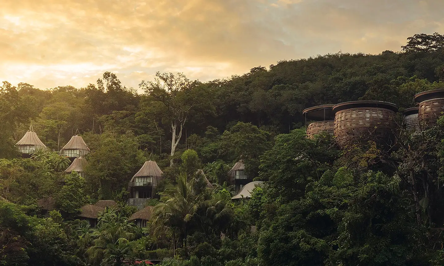 Keemala resort Phuket Thailand treehouse pod villas in rainforest canopy at dusk