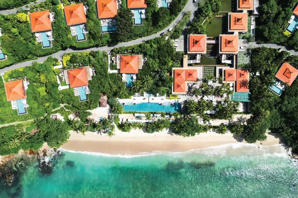 Trisara resort Phuket Thailand aerial view of private pool villas on Andaman Sea