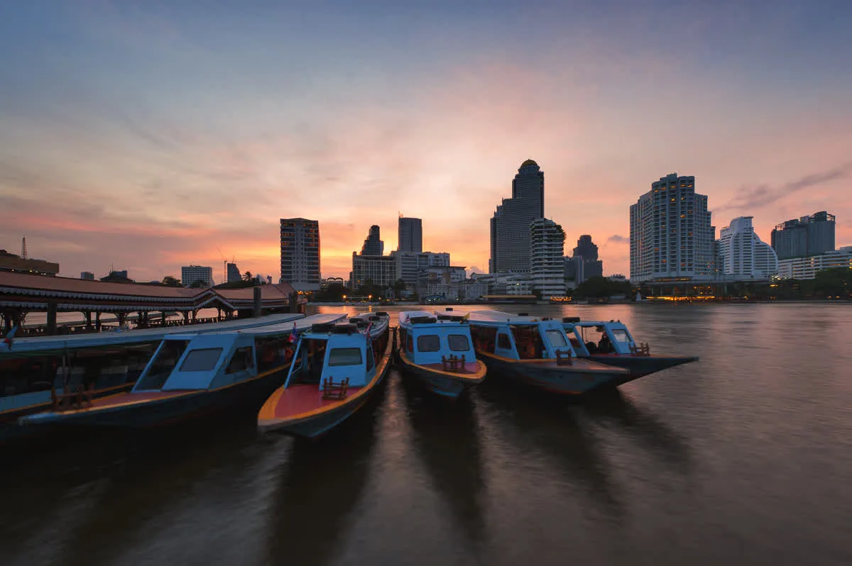 Mandarin Oriental Bangkok hotel on the Chao Phraya River at sunset