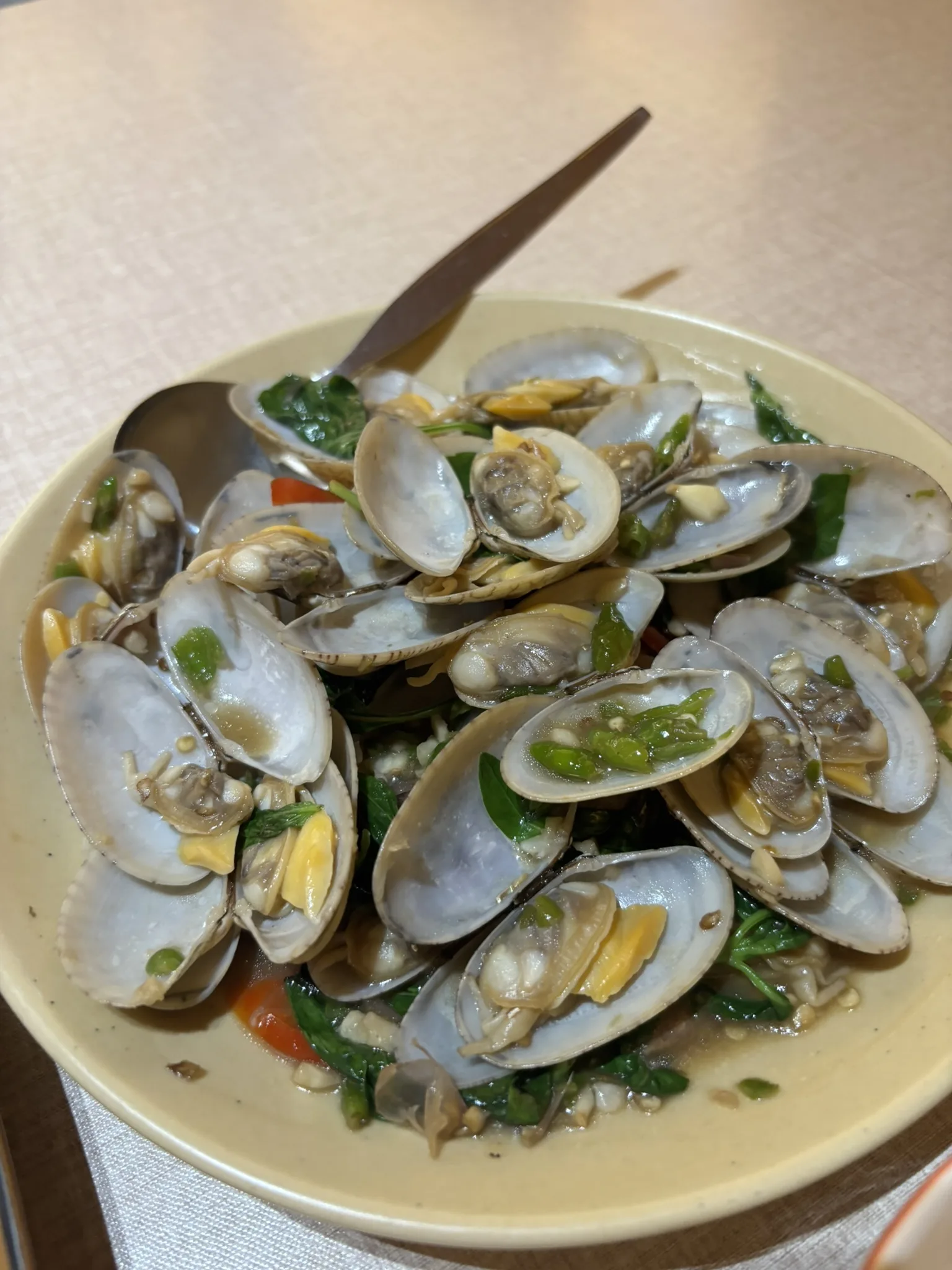 Stir-fried clams hoi lai with chili, garlic and Thai basil at Baan Ko, one of the best Hua Hin restaurants for seafood