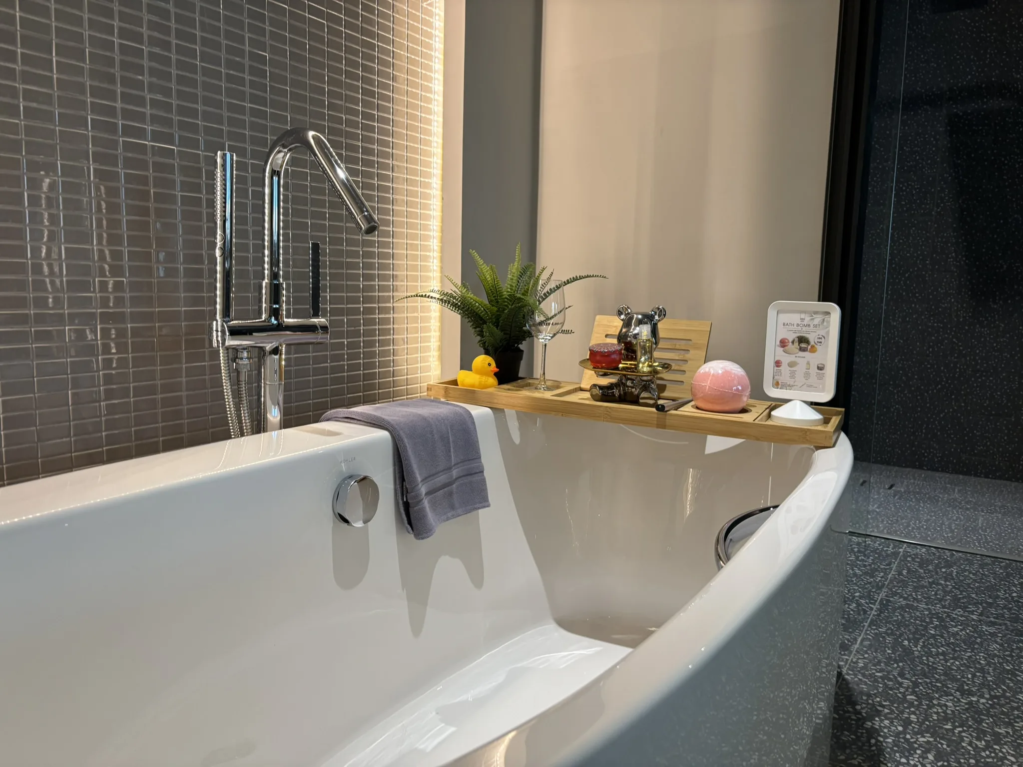 Large soaking tub with bath bomb set and candles at Cross Pattaya Pratamnak