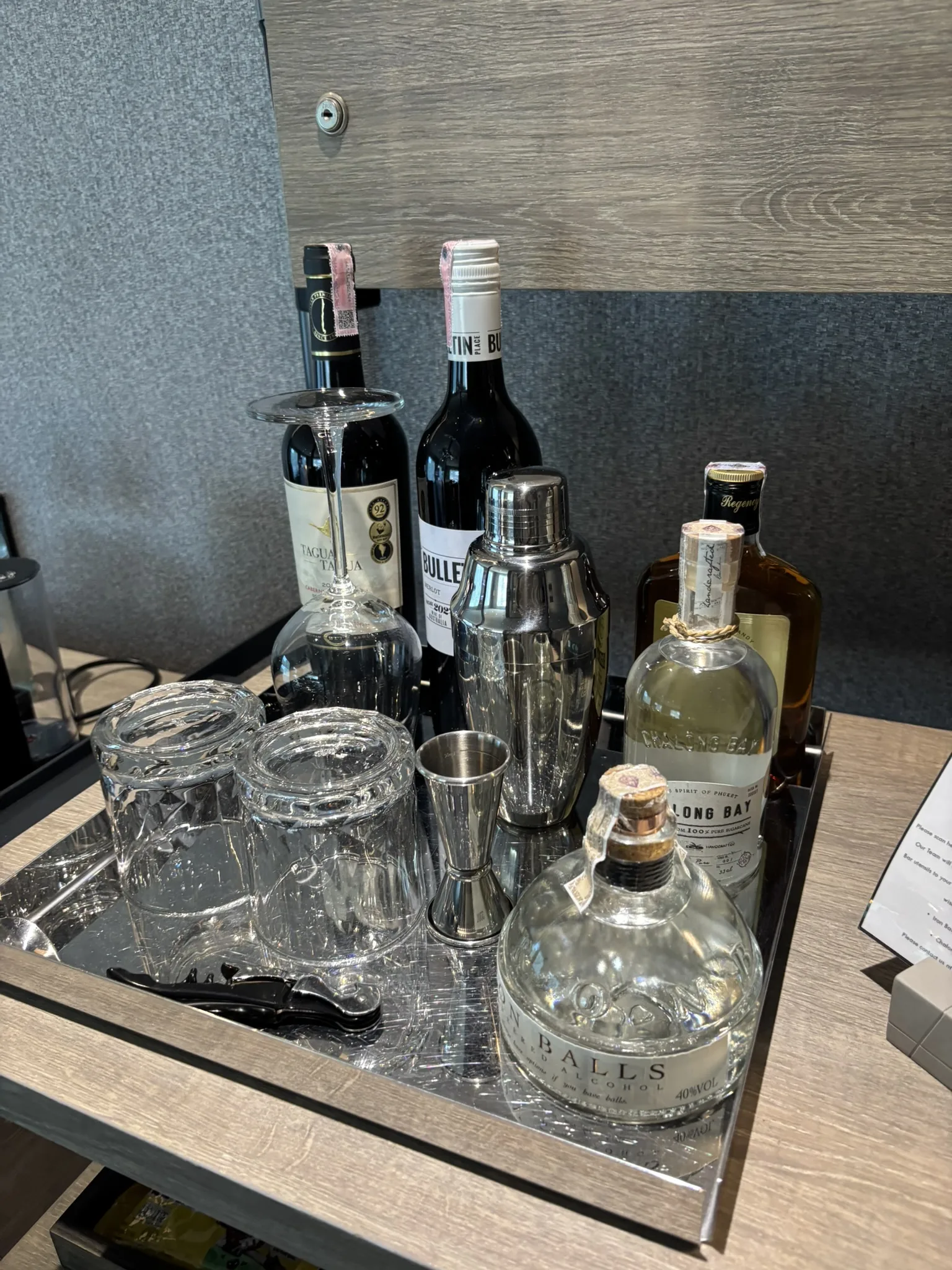 In-room private cocktail bar with spirits at Cross Pattaya Pratamnak suite