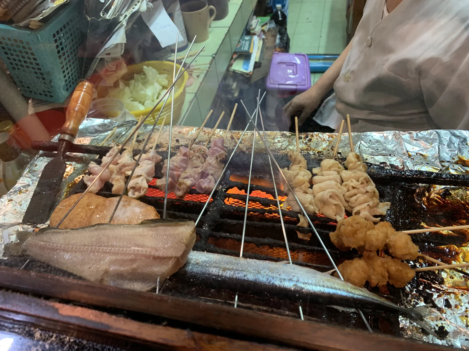 Yakitori skewers over charcoal at Kikyo, one of the Japanese restaurants in Bangkok on this list