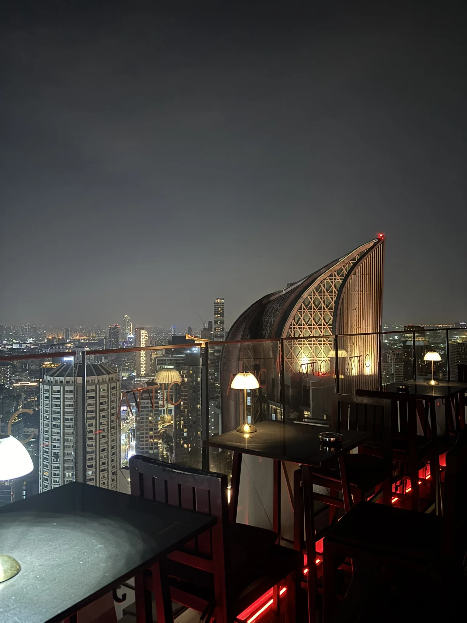 Attic by Octave rooftop terrace red lighting