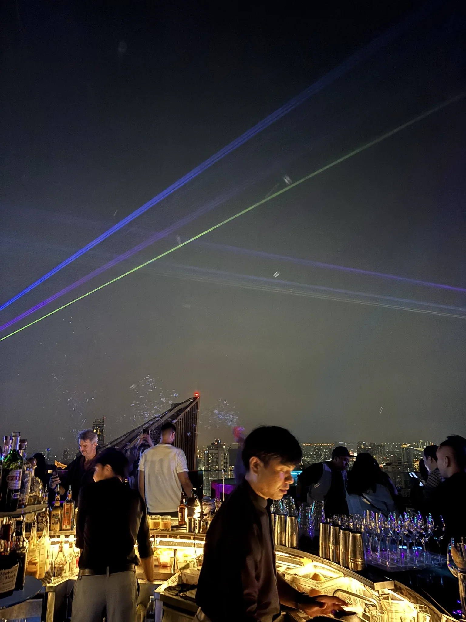 Octave rooftop bar staff pouring drinks at the counter